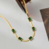 Gold plated stainless steel anti tarnish snake chain green emerald studded necklace