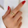Gold plated stainless steel anti tarnish clover themed adjustable finger ring