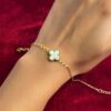 Gold plated stainless steel anti tarnish white clover themed wraparound bracelet