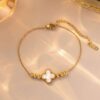Gold plated stainless steel anti tarnish white clover themed wraparound bracelet
