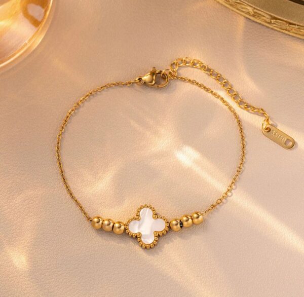 Gold plated stainless steel anti tarnish white clover themed wraparound bracelet